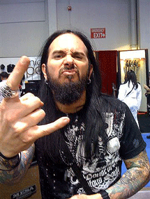 Blasko at NAMM Boogie booth throwing metal horns