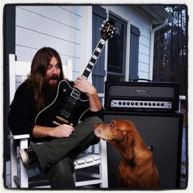 Mark Morton with a few of his best friends on the front porch